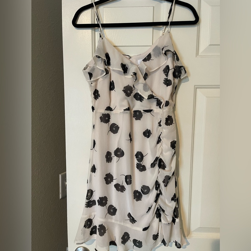Cream sleeveless mini dress with black flower print worn once